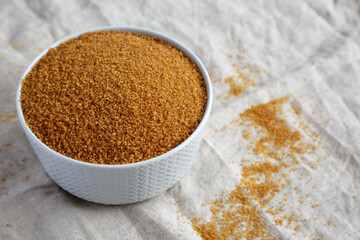 Brown Demerara Sugar in a Bowl, side view. Space for text.