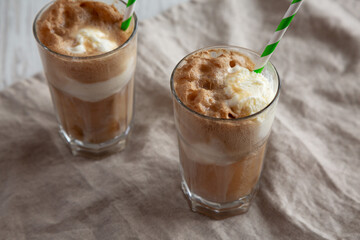 Homemade Ice Cream Float with Cola. Sweet Refreshment Drink, low angle view.