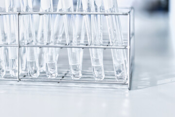 glass flask in chemical science education laboratory with molecular structure in blue background