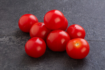 Ripe juicy cherry tomatoes heap