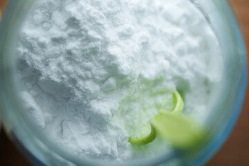 top view of baking soda on the blue background