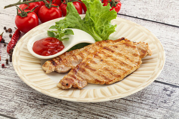 Grilled pork steak with ketchup