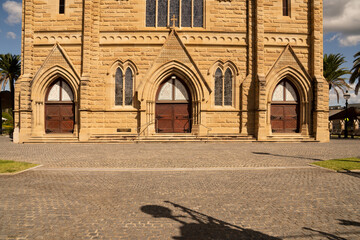 Triple entry doors to the heritage listed St Josephs' Cathedral in Rockhampton, Queensland, which is  built of sandstone.