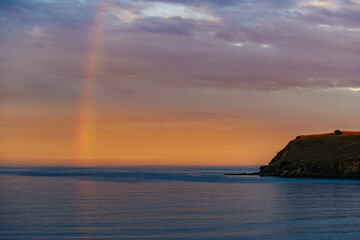 Fototapeta na wymiar Rainbow over the ocean