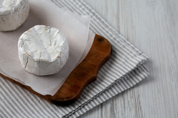 Alpine Blue Cheese on a rustic wooden board, side view. Copy space.