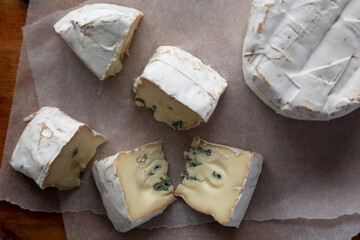 Alpine Blue Cheese on a rustic wooden board, top view. Flat lay, overhead, from above.