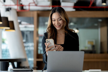 Beautiful Asian woman is a businesswoman who leads a new generation of startups, a woman who runs and manages a business plan to build confidence and stability in business, woman-led business concept.