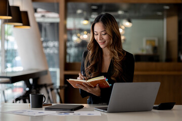 Beautiful Asian woman is a businesswoman who leads a new generation of startups, a woman who runs and manages a business plan to build confidence and stability in business, woman-led business concept.