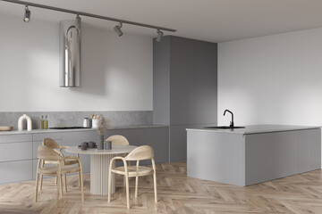 Corner view on kitchen interior with dining table with chairs