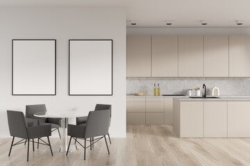 Bright kitchen room interior with two empty white posters
