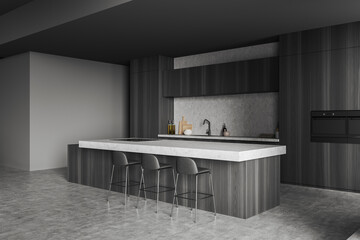 Corner view on dark kitchen interior with island with barstools