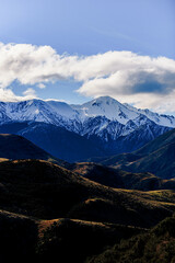 Snow covered peaks in mountain landscape