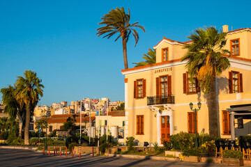View from Kountourioti street on Lavreotiki Municipal Services building, Lavrion city and palms in the foreground