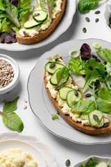 Healthy food. Sandwiches with goat cheese and greenery, ready to eat