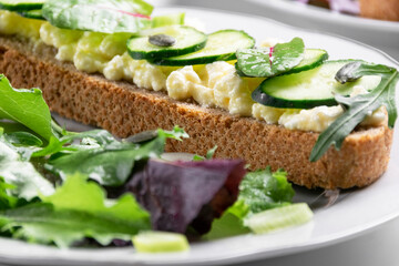 Healthy food. Sandwiches with goat cheese and greenery, ready to eat