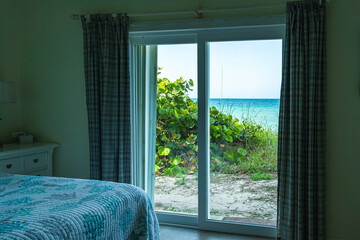 Wonderful calming view from the bedroom to the Atlantic Ocean in Florida. Coastal vacation concept.