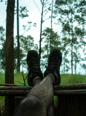 closeup shot of hiking boots, Relaxing time during a trekking, travel concept image