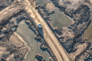 Aerial view dumper lorry collecting newly mined Oilsand