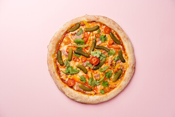Pizza with juicy bacon, cherry tomatoes, corn, cilantro, pickled cucumbers, Pilati sauce, gouda cheese and mozzarella. Pink background. Top view. Copy space