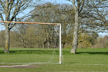 Fototapeta premium Football or soccer goals in a public park for team sports