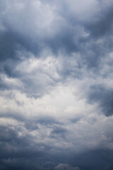 Beautiful and formidable sky with blue thunderclouds before the storm. Dramatic sky background, space for inscription.