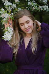 woman in a blooming flowers