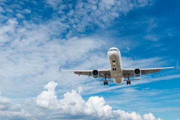 Airplane taking off against blue sky, traveling by plane