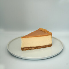 Piece of cheesecake on isolated white backround