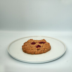 Berry cookie on white plate and isolated on white bakcground.