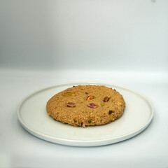 Cookie on white plate and isolated on white bakcground.