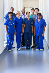 Smiling portrait multi ethnic team providing healthcare modern medical facility