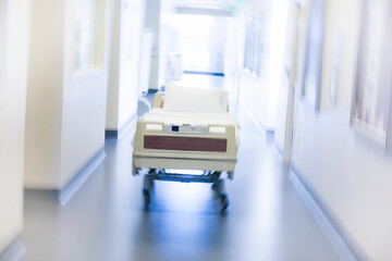 Modern hospital bed in sterile corridor of clinical healthcare facility