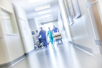 African American male female medical nursing staff hospital corridor motion blur