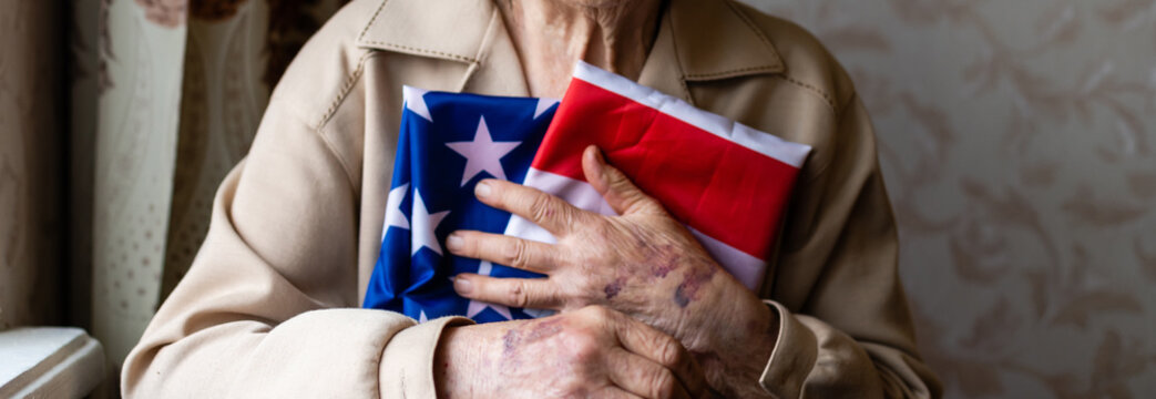 Senior who is proud to be an American, very old woman with american flag.