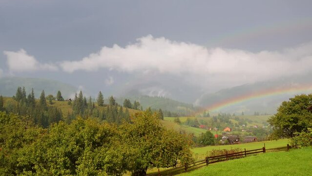Gorgeous view of rainbow in the mountains. Filmed in UHD 4k video.