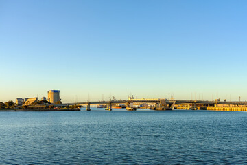 Obraz premium Industrial area of Port Adelaide with the bridge across the Port River at sunset, South Australia
