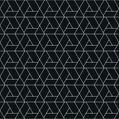 Geometric pattern of white lines on a black background. A vector illustration of a seamless pattern that is perfect for wallpaper.