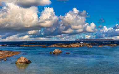 Fluffy clouds and boulders, at Greens Pool, Denmark West Australia