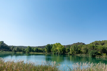 Fototapeta na wymiar natural park of the lagoons of ruidera with green and blue colors of its waters in castilla la mancha spain