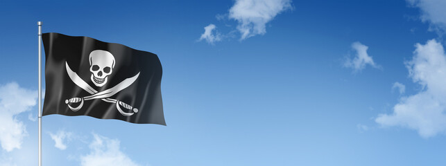Pirate flag, Jolly Roger isolated on a blue sky. Horizontal banner
