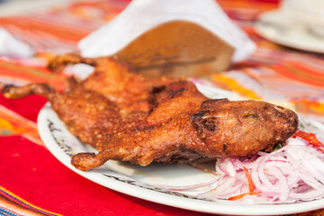Peruvian exotic grilled guinea pig dish. Cuy chactado. Andes, Peru . Selective focus