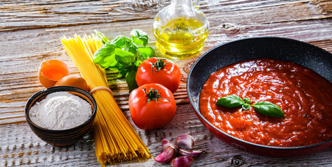 Composition with dried spaghetti, and pasta ingredients