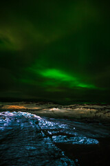 Landscape. The Northern lights in the sky beyond the Arctic Circle.