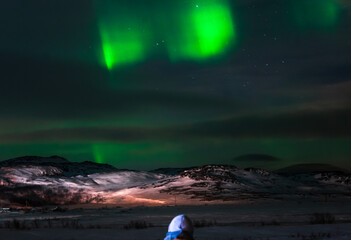 Landscape. The Northern lights in the sky beyond the Arctic Circle.
