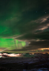 Landscape. The Northern lights in the sky beyond the Arctic Circle.