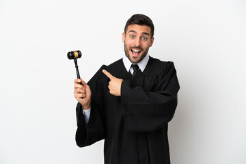 Judge caucasian man isolated on white background pointing to the side to present a product