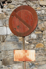 Obraz na płótnie Canvas rusty no parking sign with the holes caused by the bullets fired by the hunter to train the aim