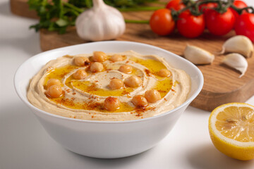 Delicious hummus with chickpeas, olive oil, lemon and pita bread. Vegetarian food concept. 