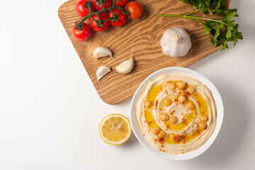 Delicious hummus with chickpeas, olive oil, lemon and pita bread. Vegetarian food concept. 