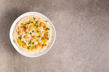 Delicious hummus with chickpeas, olive oil, lemon and pita bread. Vegetarian food concept. 